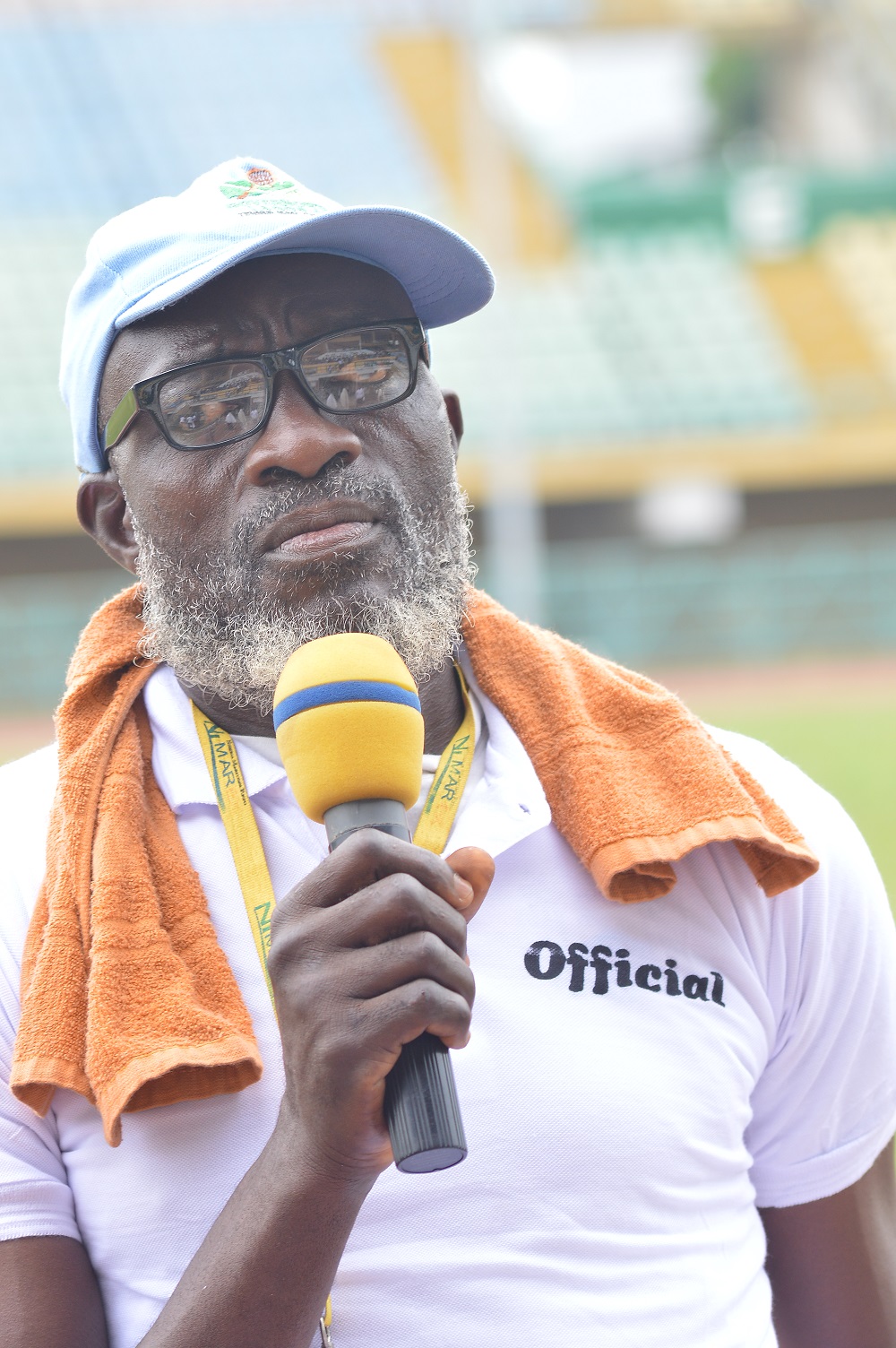 Teachers representative marching and waiving to the spectators